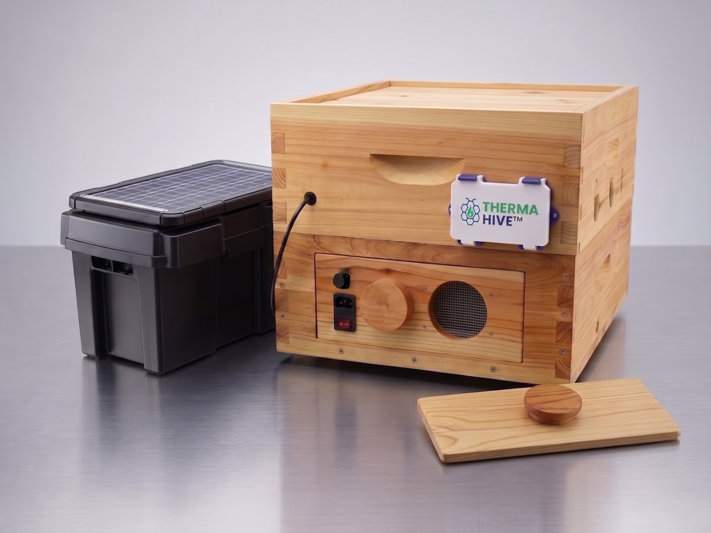 A weatherproof battery box with a mounted solar panel on its lid, built as a solar-powered battery pack for a ThermaHive unit.